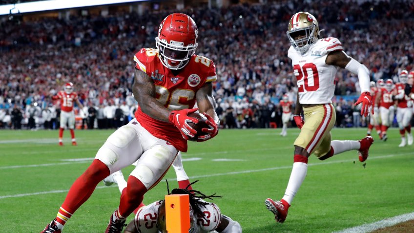 Mandatory Credit: Photo by Mark Humphrey/AP/Shutterstock (10735736a)Kansas City Chiefs' Damien Williams (26) scores a touchdown against the San Francisco 49ers during the second half of the NFL Super Bowl 54 football game in Miami Gardens, Fla.