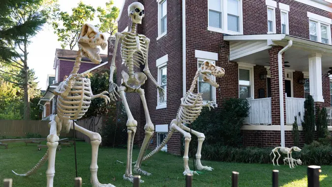 Mandatory Credit: Photo by Jacquelyn Martin/AP/Shutterstock (10954838b)Homeowner has gotten into the Halloween spirit, in Washington, with giant human and dinosaur skeleton decorationsDaily Life, Washington, United States - 14 Oct 2020.