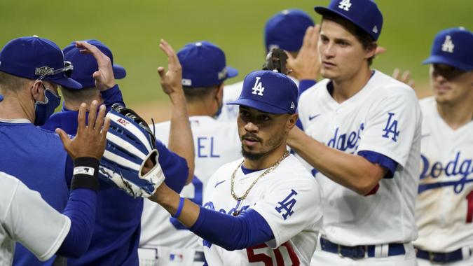 Photo by Eric Gay/AP/Shutterstock (10963350bo)Los Angeles Dodgers right fielder Mookie Betts celebrates their win in Game 6 of a baseball National League Championship Series against the Atlanta Braves, in Arlington, TexasNLCS Braves Dodgers Baseball, Arlington, United States - 17 Oct 2020.