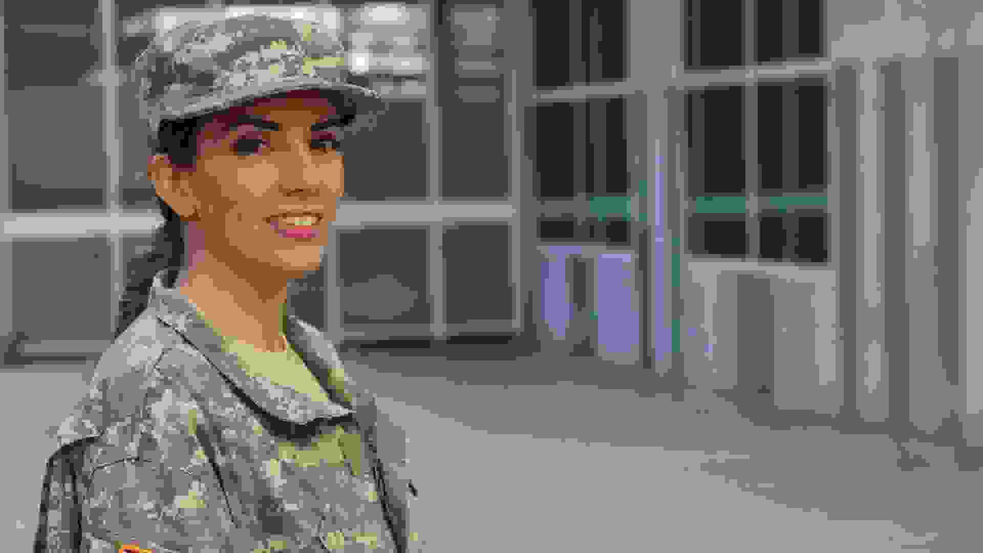 Military female smiling - Stock image with copy space.