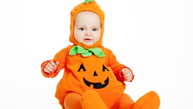 Child in pumpkin suit