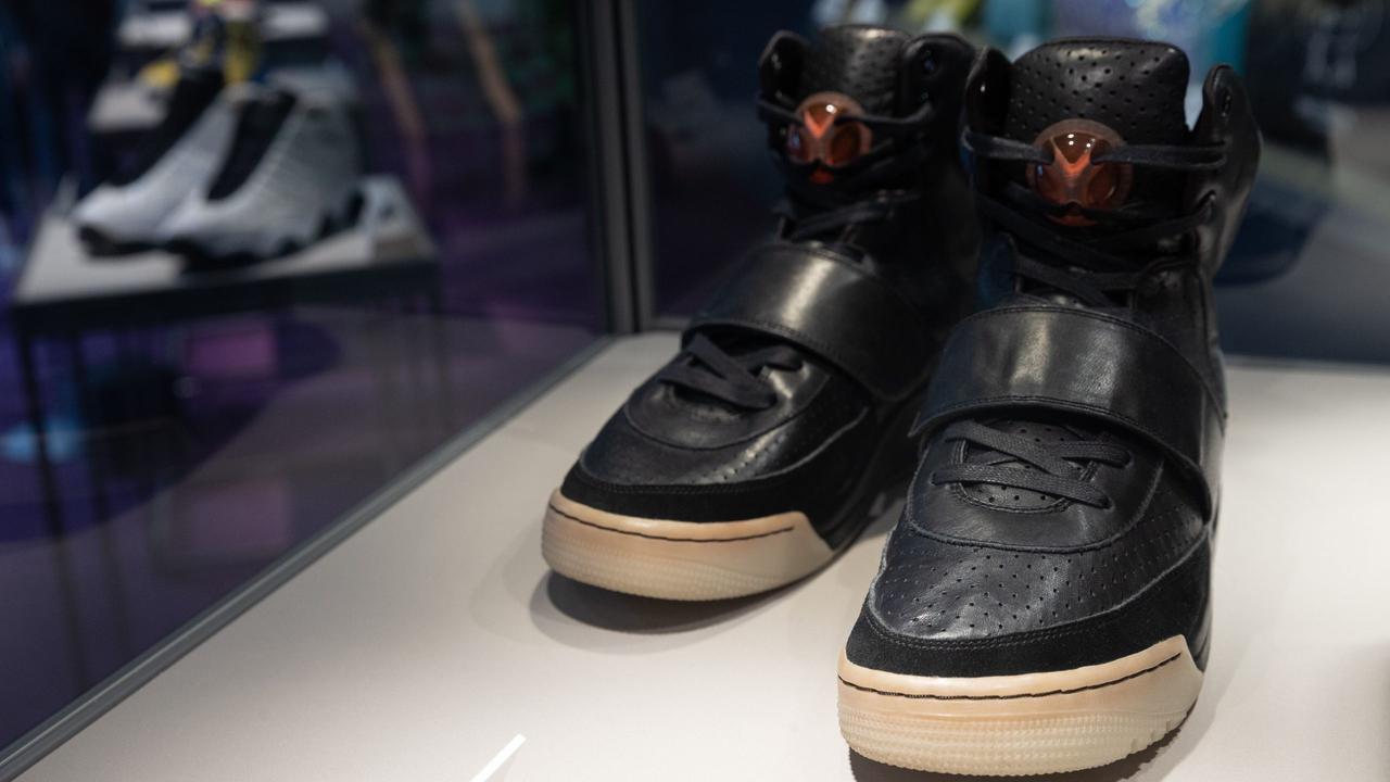 Mandatory Credit: Photo by JEROME FAVRE/EPA-EFE/Shutterstock (11862572c)Kanye West 'Grammy Worn' Nike Air Yeezy 1 Prototype sneakers (R) are on display during a Sotheby's auction preview in Hong Kong, China, 17 April 2021.