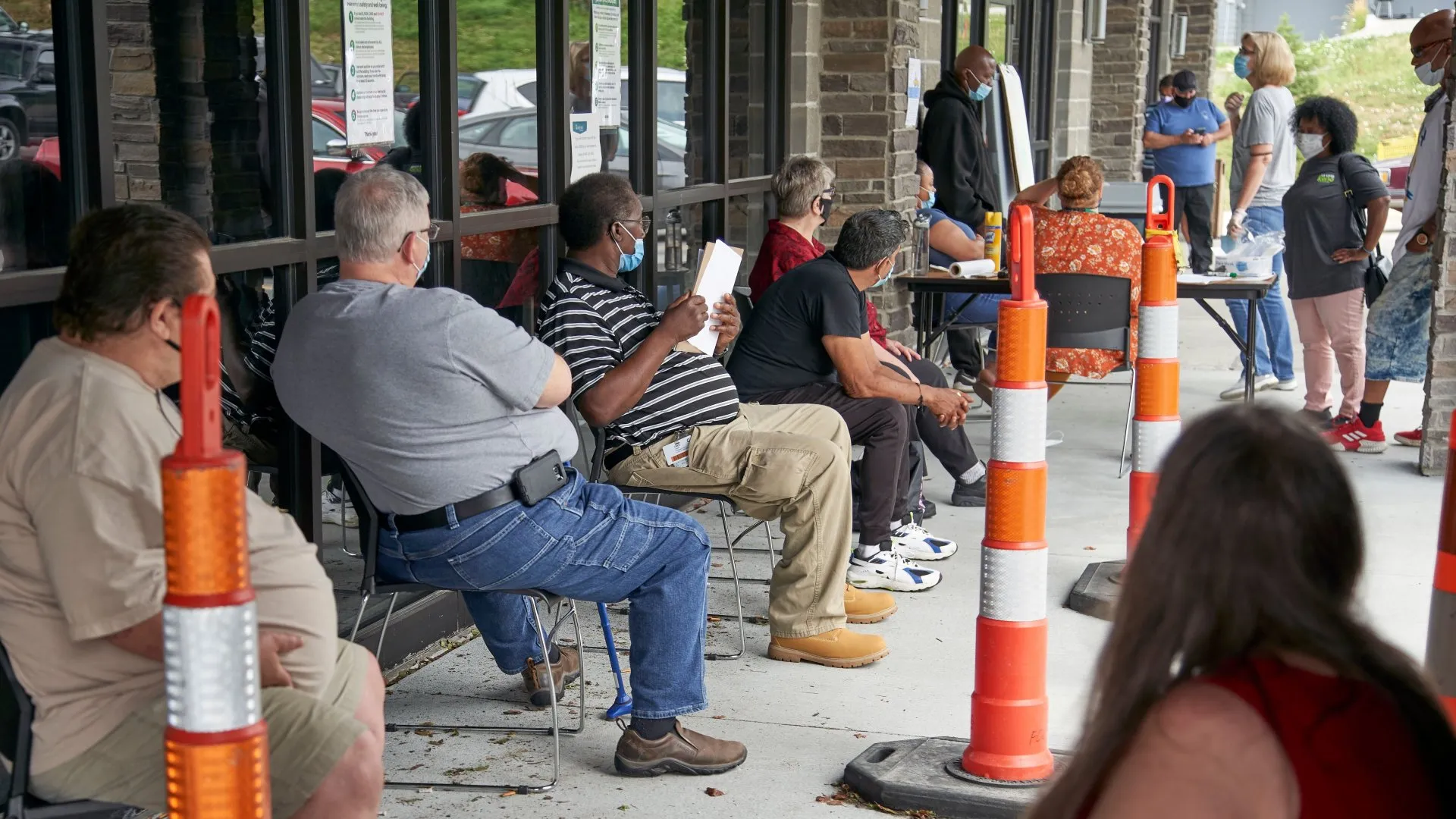 Mandatory Credit: Photo by Nati Harnik/AP/Shutterstock (10712813a)Job seekers exercise social distancing as they wait to be called into the Heartland Workforce Solutions office in Omaha, Neb.