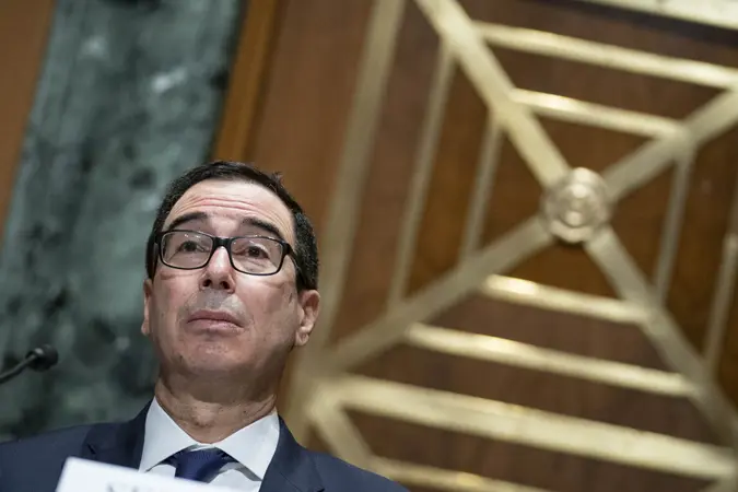 Mandatory Credit: Photo by Shutterstock (11515421r)WASHINGTON, UNITED STATES - DEC 10: Treasury Secretary Steven Mnuchin testifies before the Congressional Oversight Commission during a hearing on the "Examination of Loans to Businesses Critical to Maintaining National Security" on Capitol Hill in Washington, D.