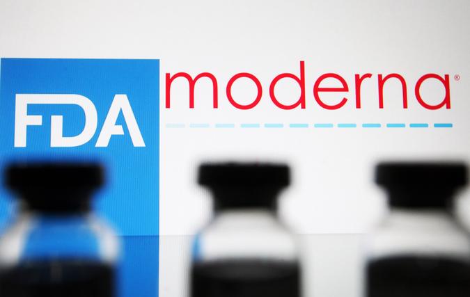 Mandatory Credit: Photo by Pavlo Gonchar/SOPA Images/Shutterstock (11554233a)In this photo illustration, vials seen displayed in front of the Food and Drug Administration (FDA) of the United States and Moderna biotechnology company's logos.