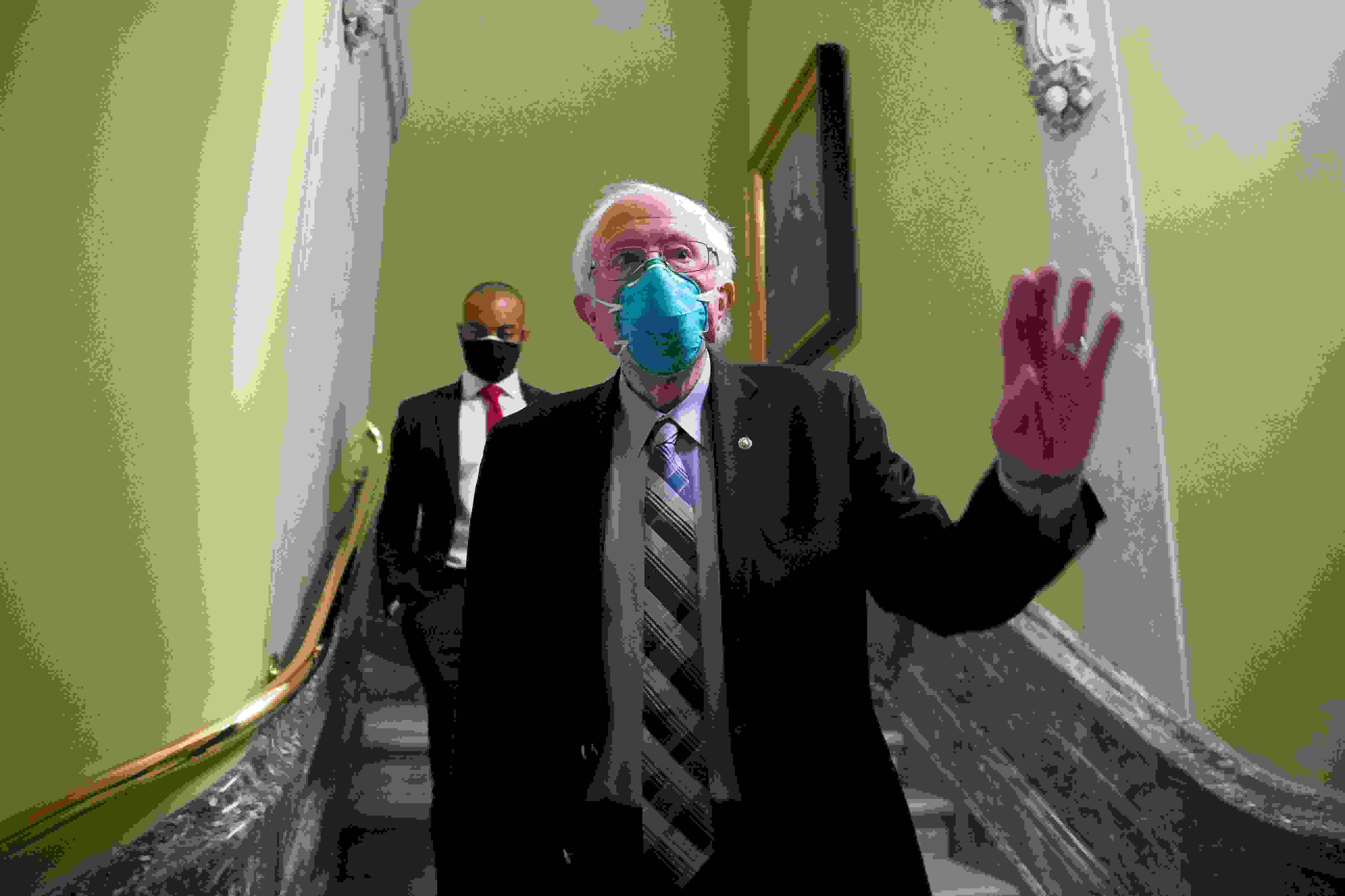 Mandatory Credit: Photo by MICHAEL REYNOLDS/EPA-EFE/Shutterstock (11650752g)Independent Senator from Vermont Bernie Sanders walks from the Senate floor during votes on Capitol Hill in Washington, DC, USA, 20 December 2020.