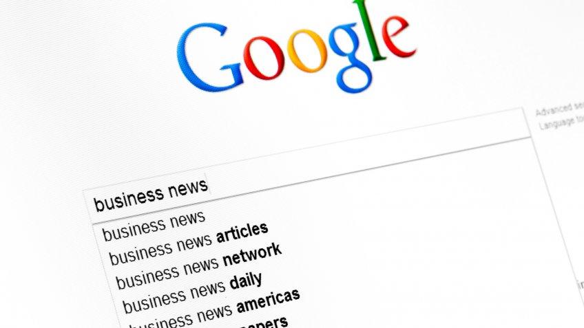 Kyiv, Ukraine - March 13, 2011: Business news text string in google search field start page.