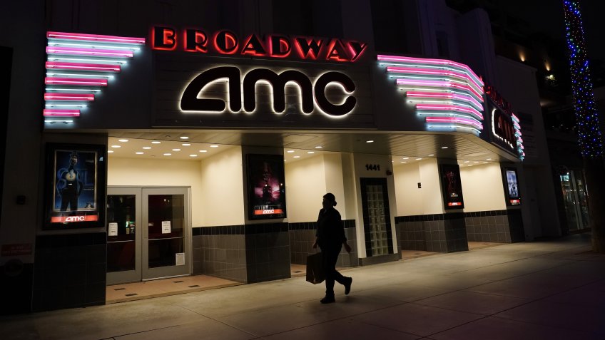 Mandatory Credit: Photo by Marcio Jose Sanchez/AP/Shutterstock (11034901a)A shopper walks past a closed AMC movie theater in Santa Monica, Calif.