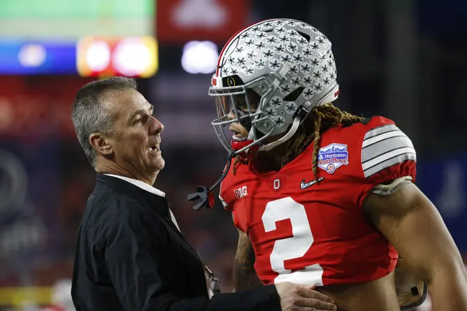 Mandatory Credit: Photo by Charles Baus/CSM/Shutterstock (10514187cr)Former Ohio State coach Urban Meyer with Ohio State Buckeyes defensive end Chase Young #2 during the Playstation Fiesta Bowl semifinal playoff game between the Ohio State Buckeyes and the Clemson Tigers at State Farm Stadium in Glendale, Arizona.