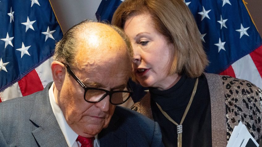 Mandatory Credit: Photo by Jacquelyn Martin/AP/Shutterstock (11024215h)Former Mayor of New York Rudy Giuliani, left, listens to Sidney Powell, both lawyers for President Donald Trump, during a news conference at the Republican National Committee headquarters, in WashingtonCongress Democrats, Washington, United States - 19 Nov 2020.