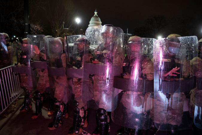Mandatory Credit: Photo by MICHAEL REYNOLDS/EPA-EFE/Shutterstock (11695567c)DC National Guard clear an area near the West Front of the US Capitol after pro-Trump protesters stormed the grounds earlier in the day, in Washington, DC, USA, 06 January 2021.