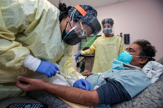 Mandatory Credit: Photo by Irfan Khan/Los Angeles Times/Shutterstock (11700056a)Nurse Salina Padilla, left, prepares Dr.