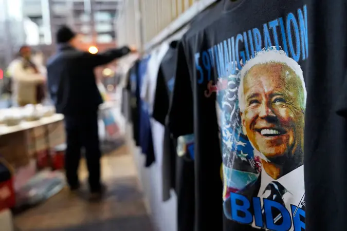 Mandatory Credit: Photo by David Goldman/AP/Shutterstock (11718139ah)Gi Chung sets up his souvenir stand with Joe Biden memorabilia ahead of President-elect Joe Biden's inauguration ceremony, in WashingtonBiden Inauguration Security, Washington, United States - 20 Jan 2021.