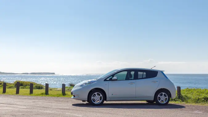 Nissan Leaf parked by the seaside.