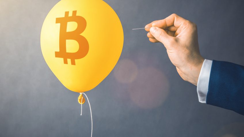 Bitcoin cryptocurrency symbol on yellow balloon.