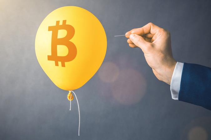 Bitcoin cryptocurrency symbol on yellow balloon.