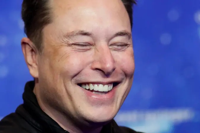 Mandatory Credit: Photo by HANNIBAL HANSCHKE/POOL/EPA-EFE/Shutterstock (11088622z)SpaceX owner and Tesla CEO Elon Musk laughs after arriving on the red carpet for the Axel Springer award, in Berlin, Germany, 01 December 2020.