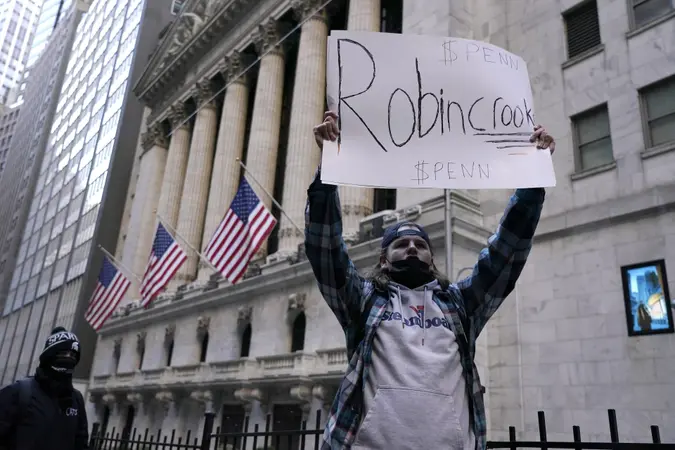 Mandatory Credit: Photo by John Lamparski/SOPA Images/Shutterstock (11734562g)A demonstrator holds up a placard saying Robin Crook in front of the New York Stock Exchange.