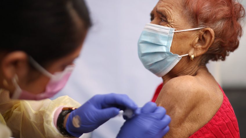 Mandatory Credit: Photo by Dania Maxwell/Los Angeles Times/Shutterstock (11759695k)Evelin Nunez, left, gives Concepcion Ponez the Pfizer vaccine during an event to inoculate about 500 health care workers and adults over the age of 65 against COVID-19 put on by the Labor Community Services, the Los Angeles Federation of Labor and St.