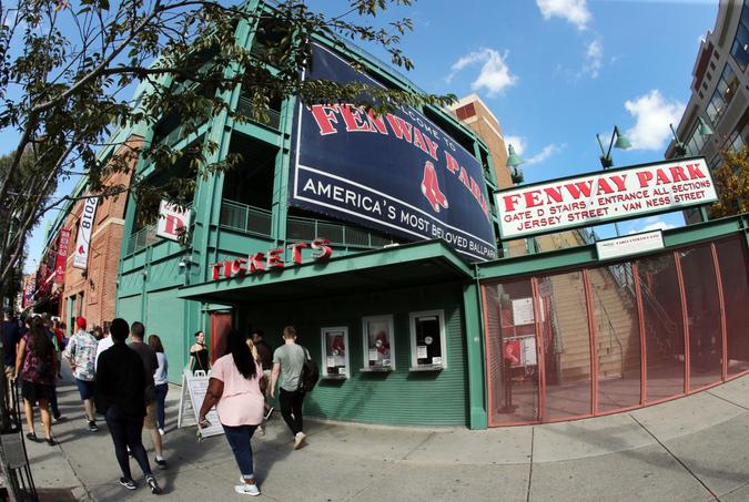 Mandatory Credit: Photo by Elise Amendola/AP/Shutterstock (9921725b)A tour group walks outside Fenway Park, in Boston.