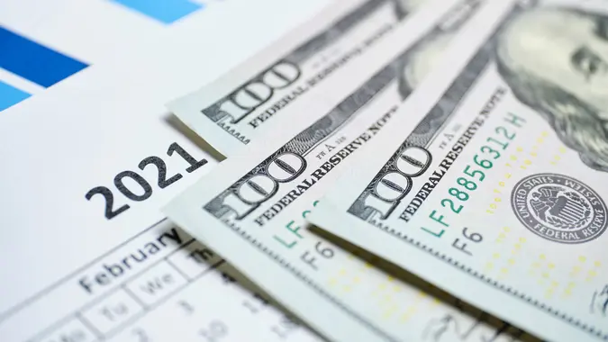 Concept of the American dollar in 2021 on the calendar.