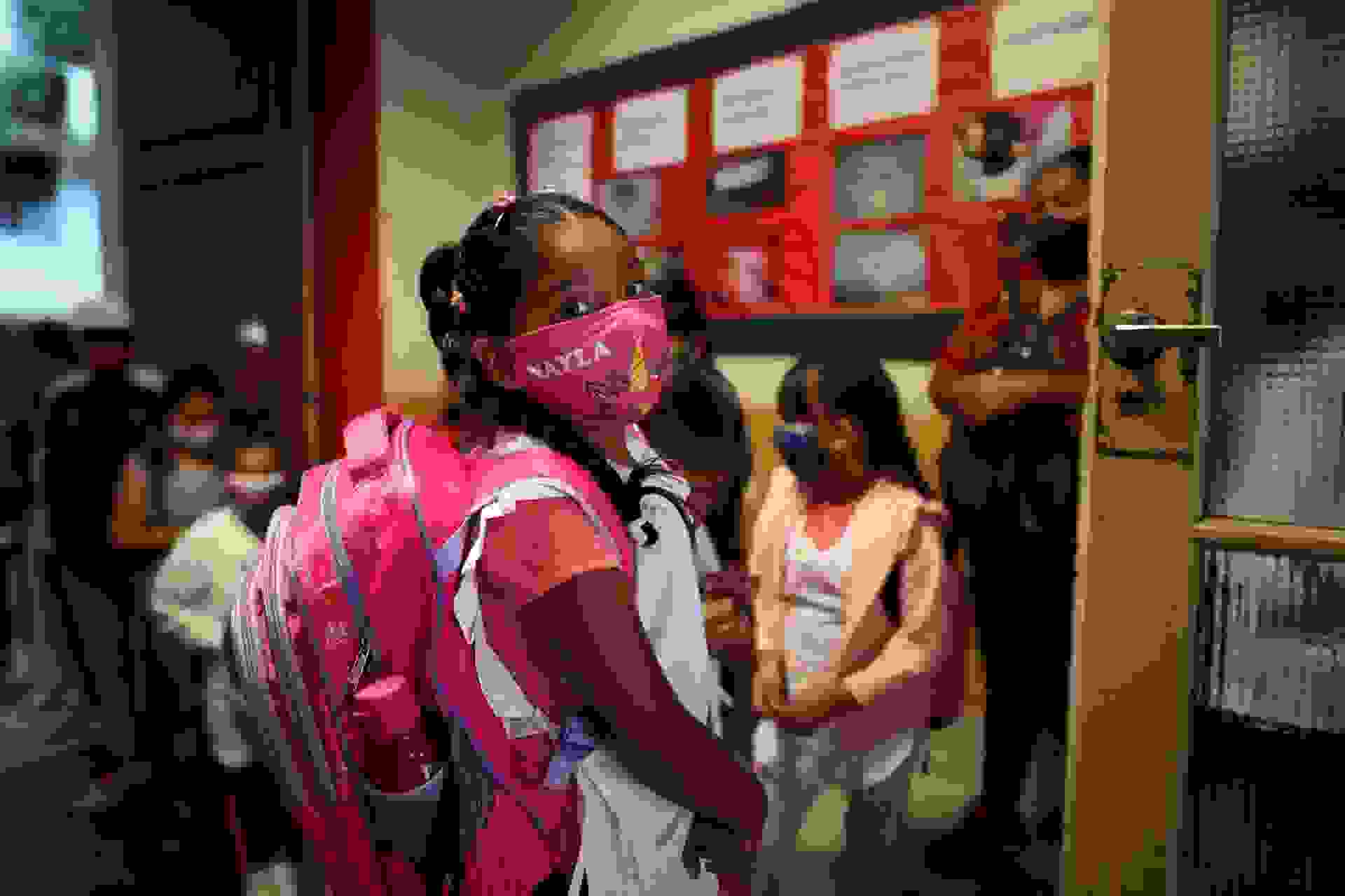 ATTENTION: This Image is part of a PHOTO SETMandatory Credit: Photo by JUAN IGNACIO RONCORONI/EPA-EFE/Shutterstock (11763342k)Several students wait to enter in their classroom at a school in Buenos Aires, Argentina, 17 February 2021.