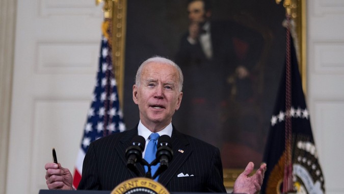 Mandatory Credit: Photo by DOUG MILLS/Shutterstock (11782938ac)President Joe Biden delivers remarks on the ongoing COVID-19 pandemic in the State Dining Room of the White House, Tuesday, March, 2, 2021.