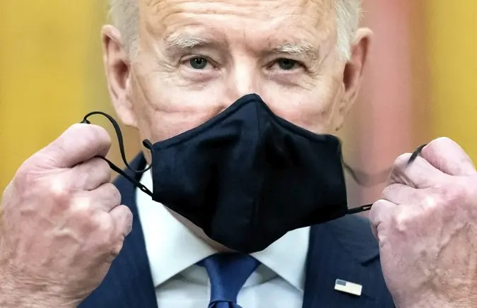 Mandatory Credit: Photo by Kevin Dietsch/UPI/Shutterstock (11791841a)President Joe Biden takes off his mast before delivering remarks at a Combatant Commander nomination event for, Air Force Gen.