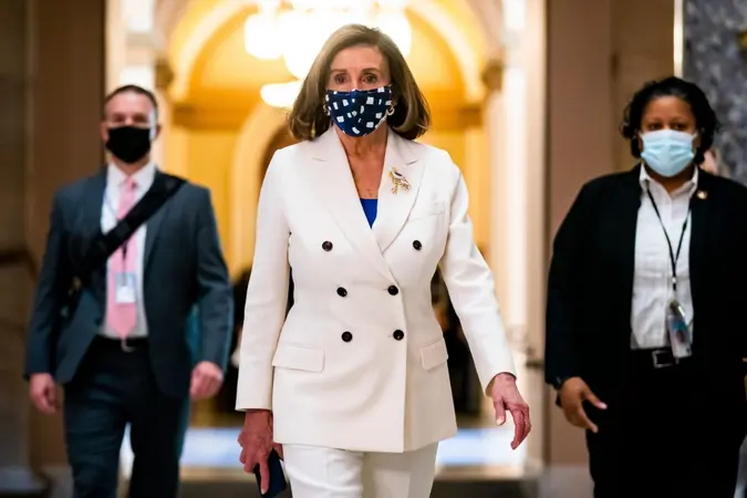 Mandatory Credit: Photo by JIM LO SCALZO/EPA-EFE/Shutterstock (11794514b)Speaker of the House from California Nancy Pelosi walks off the House floor after voting on President Biden's $1.