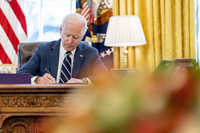 Mandatory Credit: Photo by Andrew Harnik/AP/Shutterstock (11796135c)President Joe Biden signs the American Rescue Plan, a coronavirus relief package, in the Oval Office of the White House, in WashingtonBiden, Washington, United States - 11 Mar 2021.