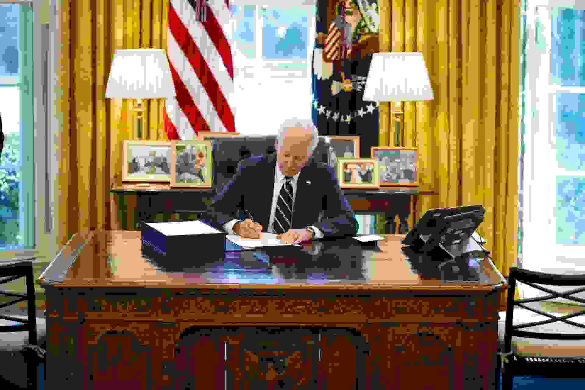 Mandatory Credit: Photo by Doug Mills/UPI/Shutterstock (11796190a)President Joe Biden signs the American Rescue Plan on in the Oval Office, Thursday, March, 11, 2021.