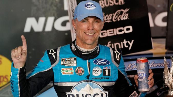 Mandatory Credit: Photo by Steve Helber/AP/Shutterstock (10782600ac)Kevin Harvick celebrates in Victory Lane after winning the NASCAR Cup Series auto race, in Bristol, TennNASCAR Cup Auto Racing, Bristol, United States - 19 Sep 2020.
