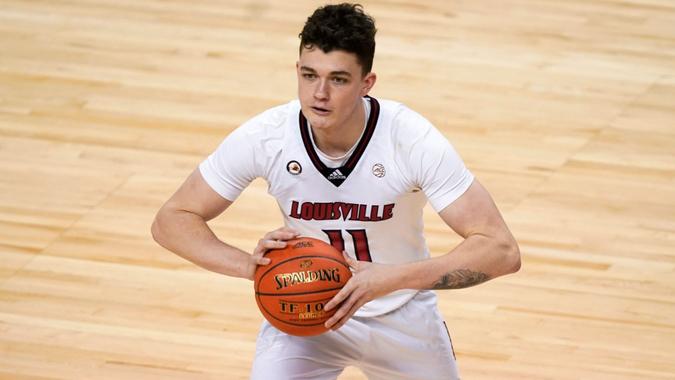 Mandatory Credit: Photo by Gerry Broome/AP/Shutterstock (11794841c)Louisville forward Quinn Slazinski (11) looks to pass the ball during the second half of an NCAA college basketball game against Duke in the second round of the Atlantic Coast Conference tournament in Greensboro, N.