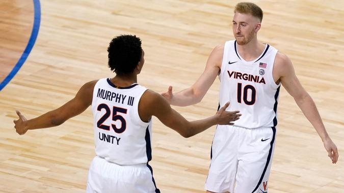 Mandatory Credit: Photo by Gerry Broome/AP/Shutterstock (11795959h)Virginia forward Sam Hauser (10) and Virginia guard Trey Murphy III (25) celebrate a basket during the second half of an NCAA college basketball game in the quarterfinal round of the Atlantic Coast Conference tournament in Greensboro, N.