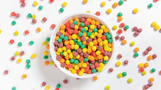 bowl-of-colorful-cereal-balls-on-white-background-picture-id1059307364