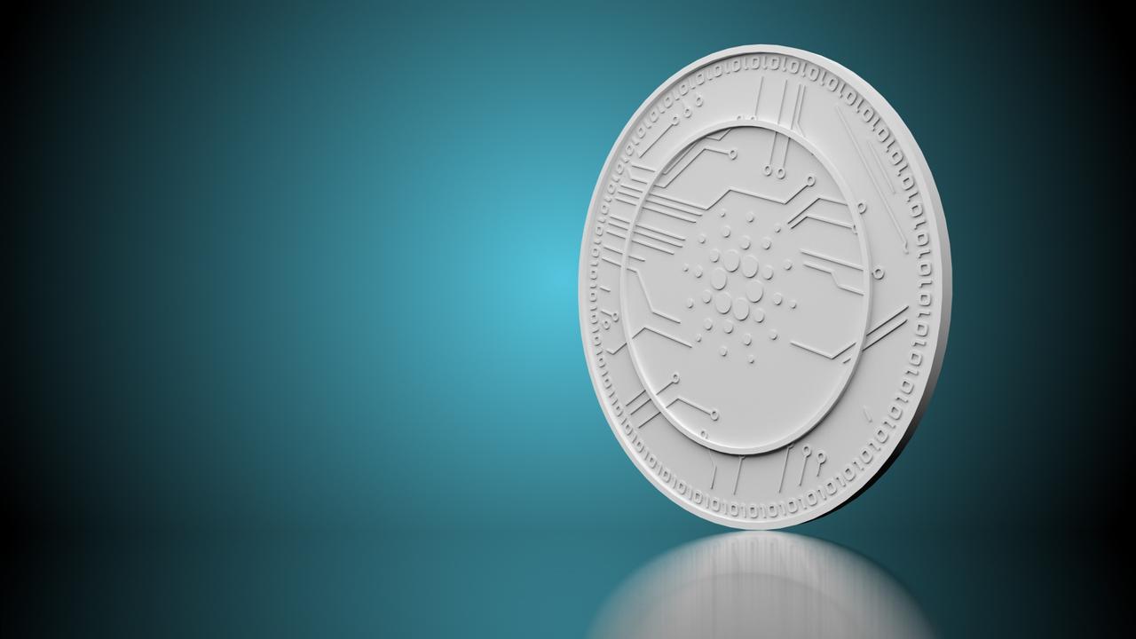 cardano crypto coin on teal background