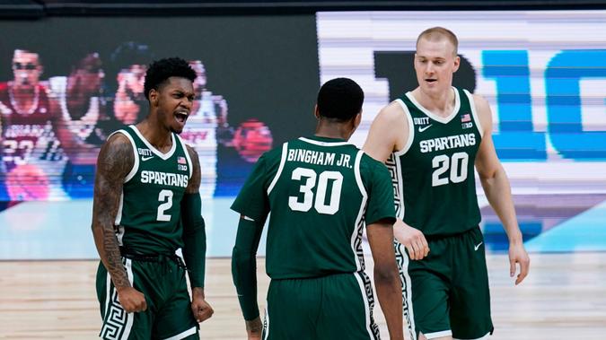 Mandatory Credit: Photo by Michael Conroy/AP/Shutterstock (11796323i)Michigan State guard Rocket Watts (2), celebrates with forward Galin Smith (30) and guard Aidan McCool (20) in the first half of an NCAA college basketball game against Maryland at the Big Ten Conference tournament in IndianapolisB10 Michigan St Maryland Basketball, Indianapolis, United States - 11 Mar 2021.