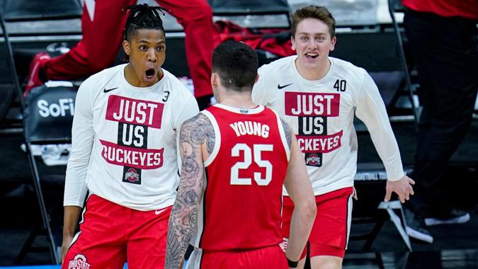 Mandatory Credit: Photo by Michael Conroy/AP/Shutterstock (11797877w)Ohio State forward Kyle Young (25) celebrates with Eugene Brown III (3) and Jansen Davidson Jr.