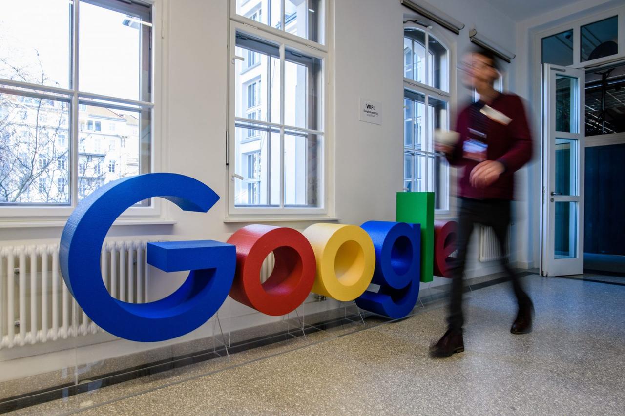 Mandatory Credit: Photo by CLEMENS BILAN/EPA-EFE/Shutterstock (10070410ad)An employee walks past a Google logo at the new Google office in Berlin, Germany, 22 January 2019.