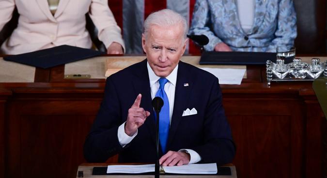 Mandatory Credit: Photo by Shutterstock (11880586f)US President Joe Biden addresses a joint session of Congress as US Vice President Kamala Harris (L) and Speaker of the United States House of Representatives Nancy Pelosi (D-CA) react at the US Capitol in Washington, DCBiden Delivers his First Address to a Joint Session of Congress, Washington, District of Columbia, USA - 28 Apr 2021.