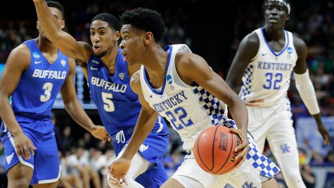 Mandatory Credit: Photo by Otto Kitsinger/AP/Shutterstock (9469538a)Kentucky guard Shai Gilgeous-Alexander (22) drives against Buffalo guard CJ Massinburg (5) during the first half of a second-round game in the NCAA men's college basketball tournament, in Boise, IdahoNCAA Buffalo Kentucky Basketball, Boise, USA - 17 Mar 2018.