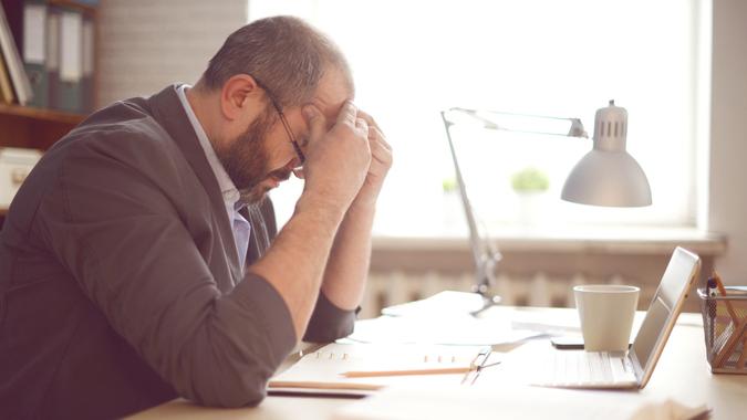 Mature Adult man working in the office.
