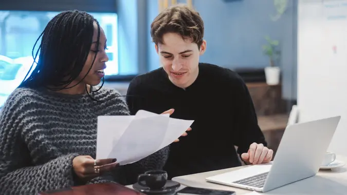 Young Generation Z couple planning their investments and savings stock photo