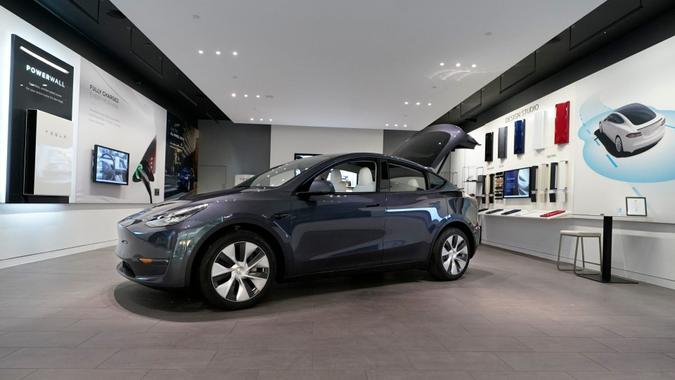 Mandatory Credit: Photo by Carlos Osorio/AP/Shutterstock (11800454d)Tesla Model Y Long Range is displayed, at the Tesla Gallery in Troy, Mich.