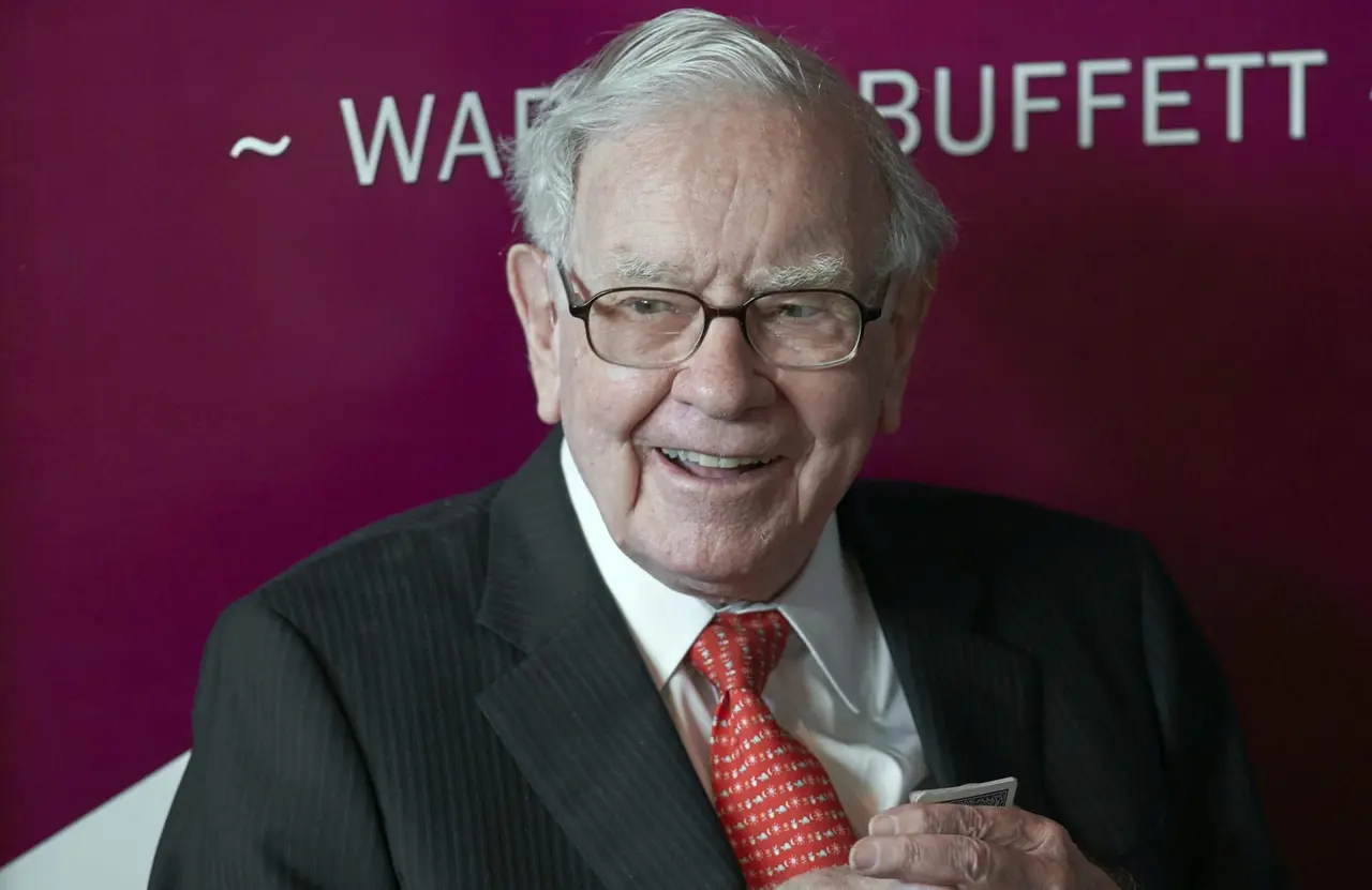 Mandatory Credit: Photo by Nati Harnik/AP/Shutterstock (10725771a)Warren Buffett, Chairman and CEO of Berkshire Hathaway, smiles as he plays bridge following the annual Berkshire Hathaway shareholders meeting in Omaha, Neb.