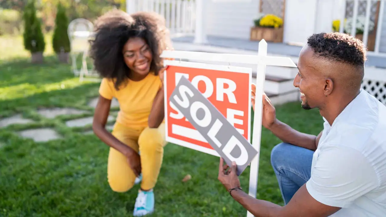 Young couple buying a new house.