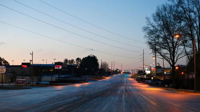 Mandatory Credit: Photo by Brynn Anderson/AP/Shutterstock (7746529c)Ice covers the roads, in Hoover, AlaWinter Weather Alabama, Hoover, USA - 07 Jan 2017.