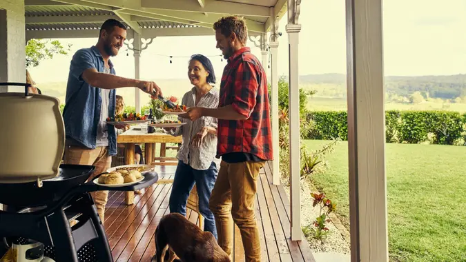 Shot of people getting food fresh off the braai.