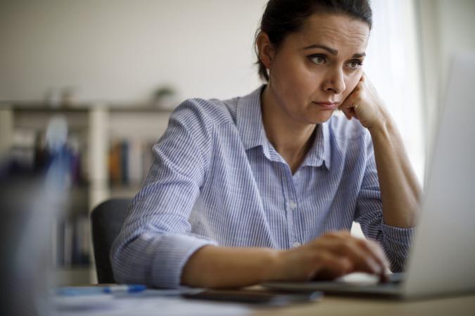 Woman struggling with new technology.