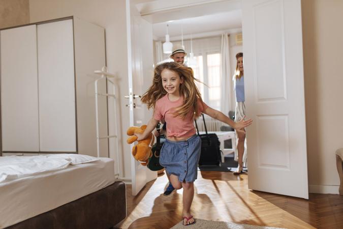 Shot of a happy family entering their accomodation.